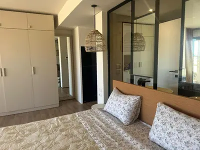 a bedroom with a large bed with two pillows on it at Barefoot Beachfront Cabana with Open SeaView,Mesca in Hurghada