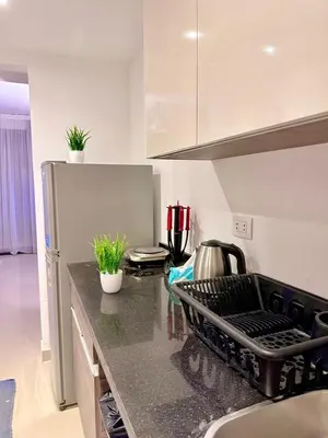 a kitchen with a counter top with plants on it at G Grips Grand 4 in El Gouna