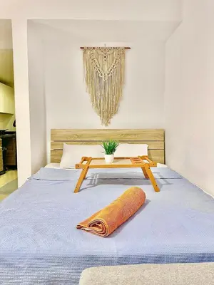 a bedroom with a bed with a table on it at G Grips Grand 4 in El Gouna