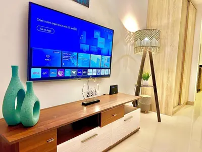 a living room with a large flat screen tv at G Grips Grand 4 in El Gouna