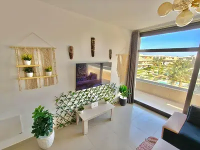 a living room with a view of the ocean at Gcrips in El Gouna