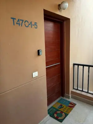 a door to a building with a sign on it at Hayloft 1 bedroom tawila, Plaza ElGouna in Hurghada