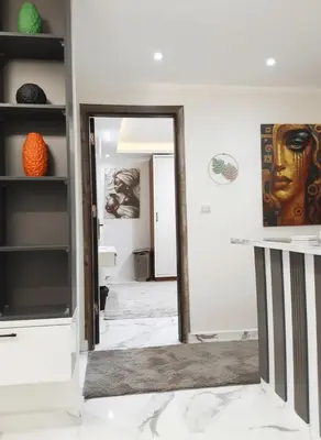 a hallway with a mirror in a room at HUB resort Luxury apartment on the pool in Hurghada