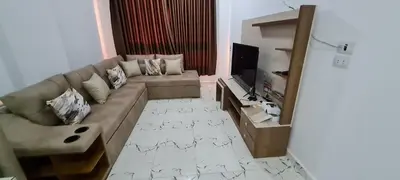 a living room with a couch and a television at La Bellal Star Hurghada A103 in Hurghada