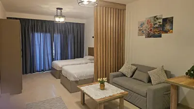 a living room with a couch and a bed at Paradise Studio with pool in Hurghada