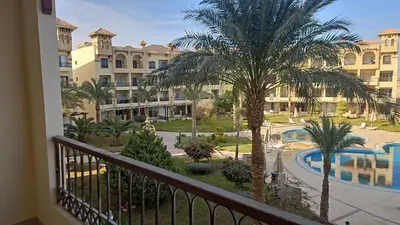 a view from the balcony of a resort at Paradise Studio with pool in Hurghada