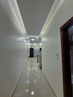 a long hallway with white walls and a ceiling at الاقصر in Luxor