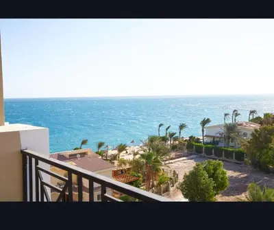 a view of the ocean from the balcony of a condo at Juliana beach luxury family suites in Hurghada