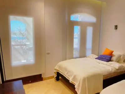 a bedroom with a bed and a window at El Gouna - Sabina - Lagoon Chalet - 2 bedrooms - Ground Floor in El Gouna