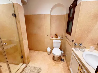 a bathroom with a toilet and a shower and a sink at El Gouna - Sabina - Lagoon Chalet - 2 bedrooms - Ground Floor in El Gouna