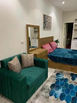 a living room with a couch and a bed at Sea Light Arabia in Hurghada