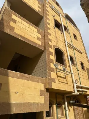 a building is being constructed with wooden panels at malee cashie in Aswan