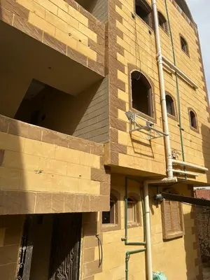 a building is being constructed with wood panels at malee cashie in Aswan