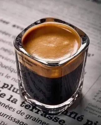 a cup of coffee sitting on top of a book at apartment 20 in Hurghada