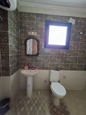 a bathroom with a toilet and a sink at Apartment for Rent Hurghada, Oasis Marina Resort in Hurghada
