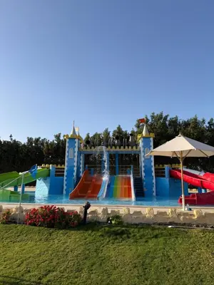 a water park with a slide and a fountain at Studio in gravity hotel & aquapark hurghada in Hurghada