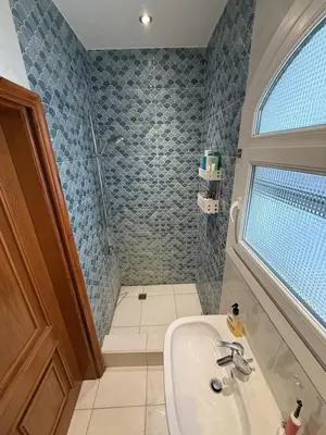 a bathroom with a sink and a shower at One bedroom apartment with stunning sea view in Hurghada