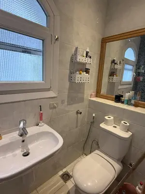 a bathroom with a toilet and a sink at One bedroom apartment with stunning sea view in Hurghada