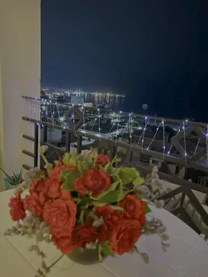 a bouquet of flowers sitting on top of a table at One bedroom apartment with stunning sea view in Hurghada