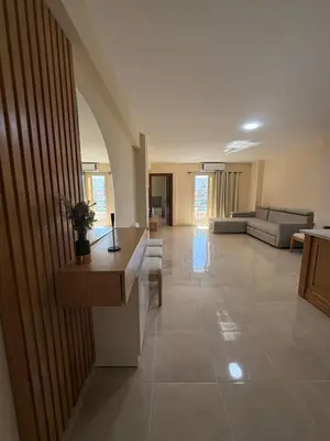 a large living room with a couch and a table at TIBA GOLDEN Hurgada in Hurghada