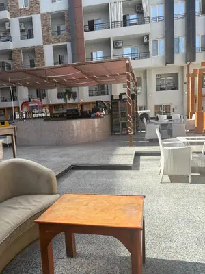 a living room with a couch and a coffee table at TIBA GOLDEN Hurgada in Hurghada