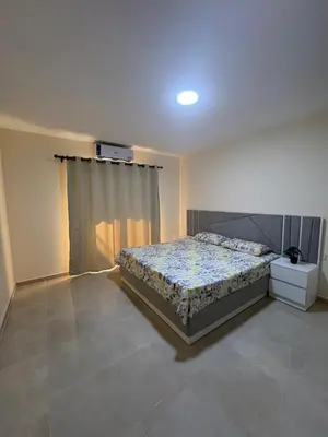 a bedroom with a bed and a window in it at TIBA GOLDEN Hurgada in Hurghada
