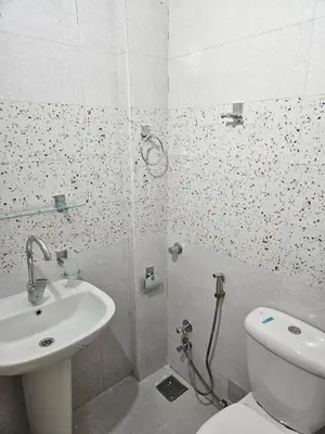 a bathroom with a shower and a toilet and a sink at Hepton hotel
