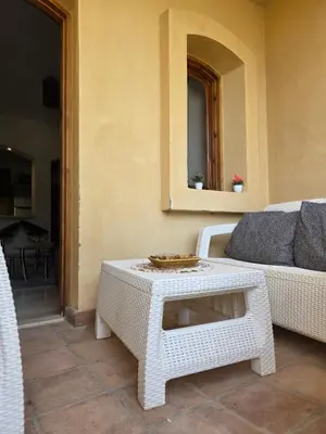 a living room with a couch and a coffee table at Westgolf Y62 in Hurghada