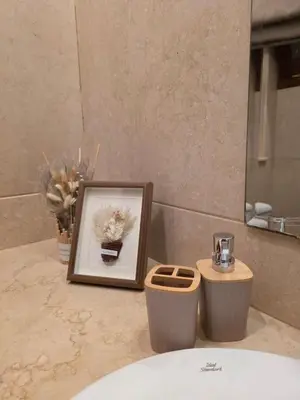 a picture and a picture frame on a sink in a bathroom at Westgolf Y62 in Hurghada