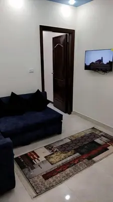a living room with a couch and a door at Apartment in sherry street near sheraton in Hurghada