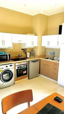 a kitchen with a stove and a microwave at Best view in Makadi bay private rooftop PHASE 2 Makadi Heights in Hurghada