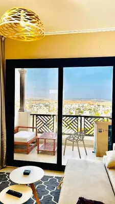 a living room with a view of a city at Best view in Makadi bay private rooftop PHASE 2 Makadi Heights in Hurghada