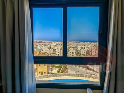 a view of a city from a window at Best view in Makadi bay private rooftop PHASE 2 Makadi Heights in Hurghada