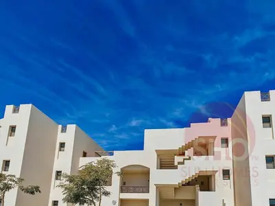 a white building with a blue sky in the background at Best view in Makadi bay private rooftop PHASE 2 Makadi Heights in Hurghada