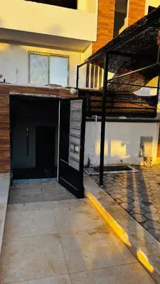 a building with a garage with a staircase in it at Magwish in Hurghada