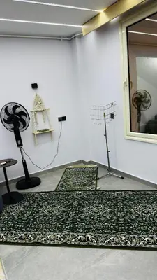 a room with two microphones and a mirror at Magwish in Hurghada