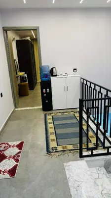 a room with a staircase and a rug on the floor at Magwish in Hurghada
