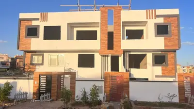a building with an open door in front of it at Magwish in Hurghada
