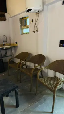 a group of chairs sitting in a room at Magwish in Hurghada
