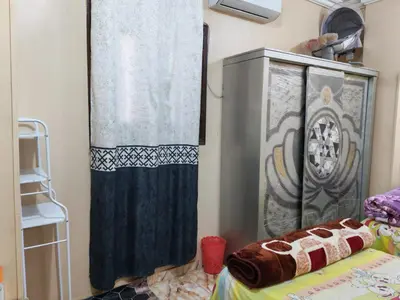 a room with a shower curtain and a bed at روف كناريا in Luxor
