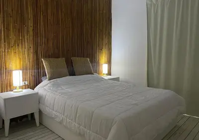 a bedroom with a large bed with two night stands at Luxury One-Bedroom Apartment Near El Gouna in Hurghada