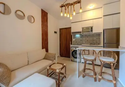 a living room with a couch and a kitchen at Luxury One-Bedroom Apartment Near El Gouna in Hurghada