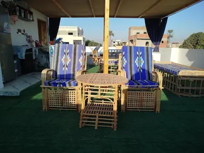 a group of chairs and a table on a patio at Villa-Djorf Westbank in Al Aqālitah