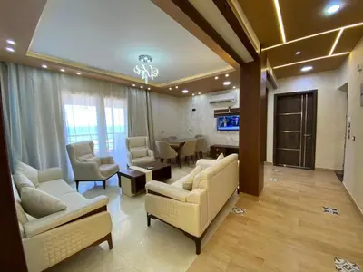 a large living room with couches and a dining room at Star Beach in Hurghada