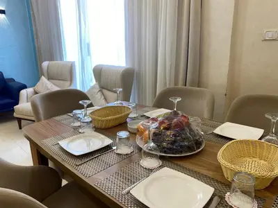 a dining room table with plates and glasses on it at Star Beach in Hurghada