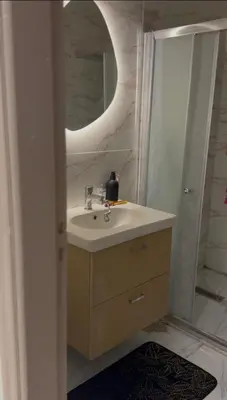 a bathroom with a sink and a mirror at Stylish home & Free transfers in Hurghada