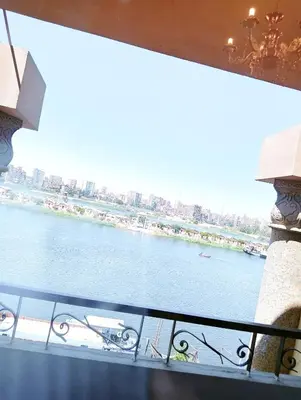 a view of a river from a balcony at VIP hotel & café in Qilfāw