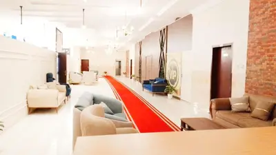 a living room with couches and a couch at VIP hotel & café in Qilfāw