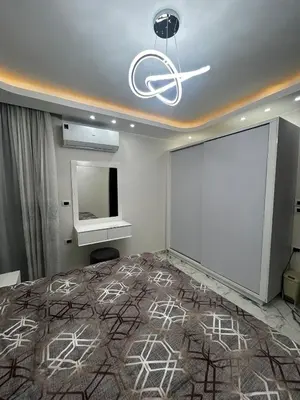 a room with a white projection screen and a white board at Hub Hurghada Two Bedroom Luxury Apartment in Hurghada