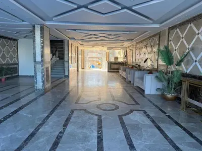 a lobby with a couch and a fireplace at Hub Hurghada Two Bedroom Luxury Apartment in Hurghada